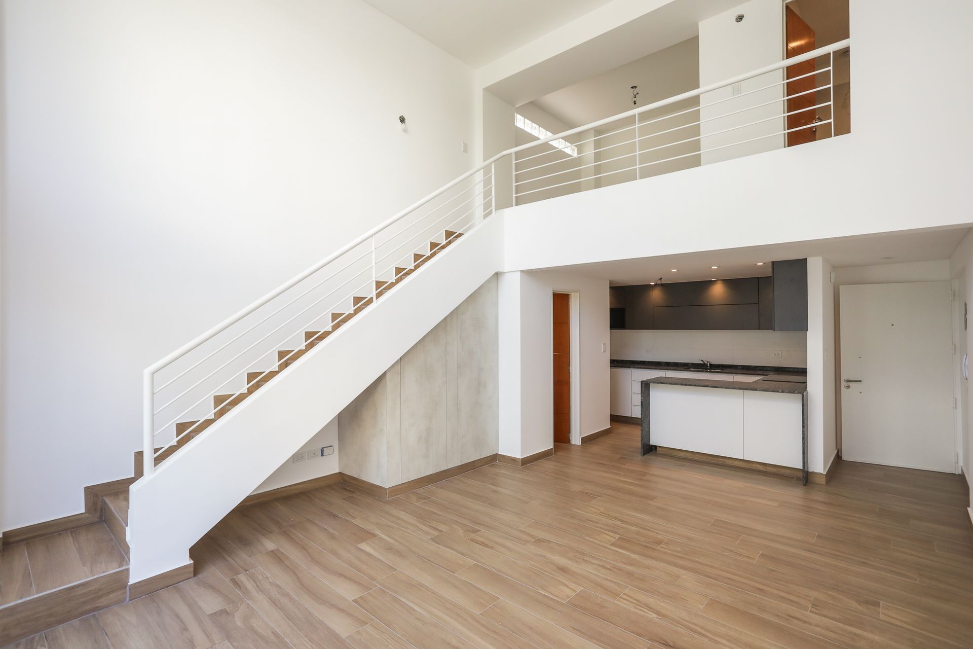 Two-room front loft with balcony, garage, and amenities