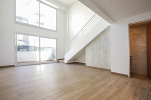 Two-room front loft with balcony, garage, and amenities