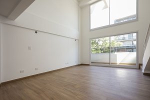 Two-room front loft with balcony, garage, and amenities