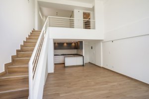 Two-room front loft with balcony, garage, and amenities