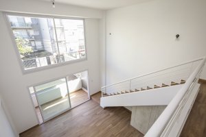 Two-room front loft with balcony, garage, and amenities